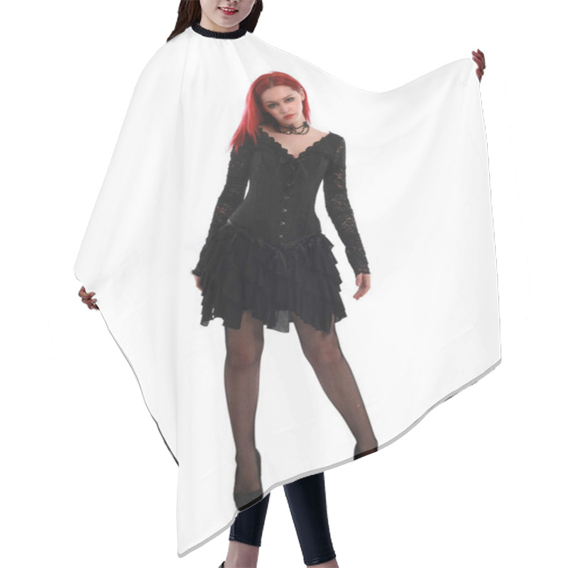 Personality  Full Length Portrait Of A  Red Haired Girl Wearing A  Black Gothic Gown, Standing Pose On A Grey Studio Background. Hair Cutting Cape