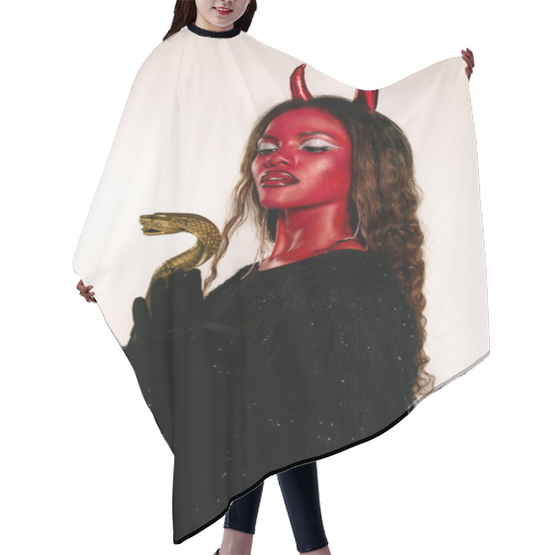 Personality  The Captivating Woman Dressed As A Devil Stands Confidently, Showcasing Her Halloween Spirit. Hair Cutting Cape