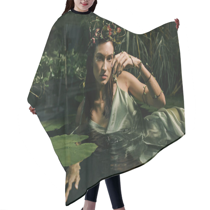 Personality  A Woman Wearing A Floral Crown And Green Dress Poses In A Swamp. Hair Cutting Cape