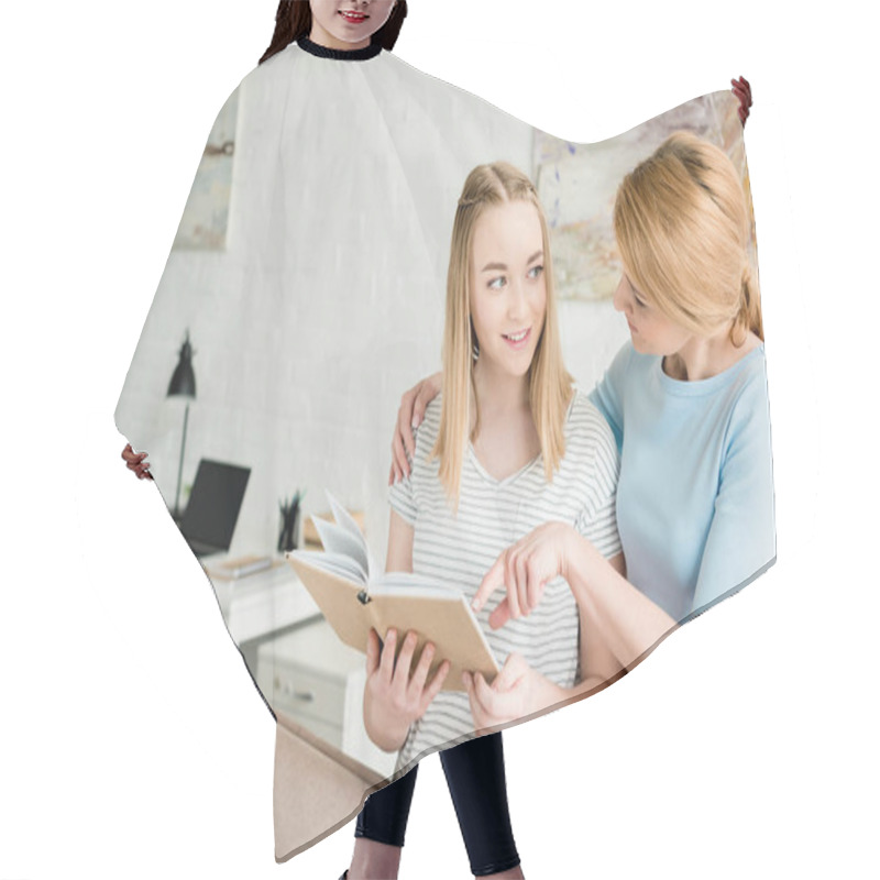 Personality  Mother And Teen Daughter Reading Book Together At Home Hair Cutting Cape