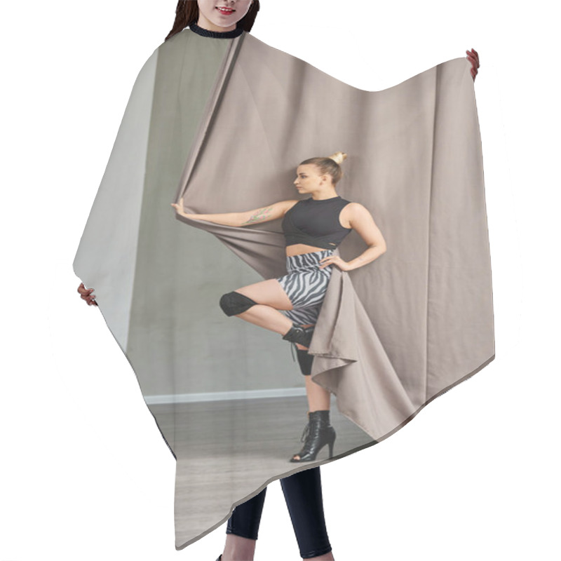 Personality  Woman Strikes A Pose In A Graceful Dance Move, Balancing On One Foot Against A Curtain-covered Wall Hair Cutting Cape