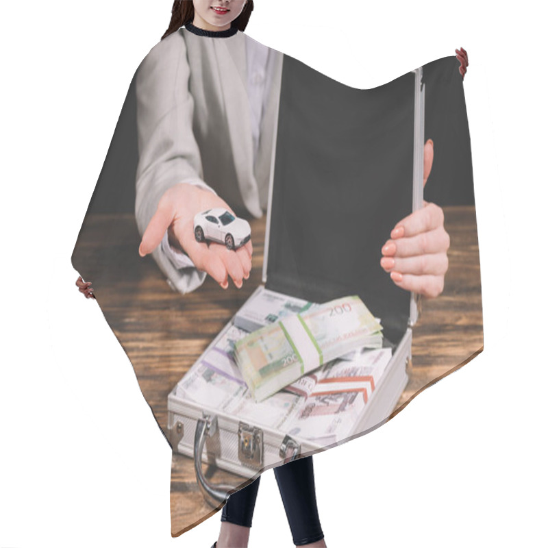 Personality  Cropped Shot Of Businesswoman Holding Model Car And Suitcase Safe Box With Russian Rubles On Wooden Table Hair Cutting Cape