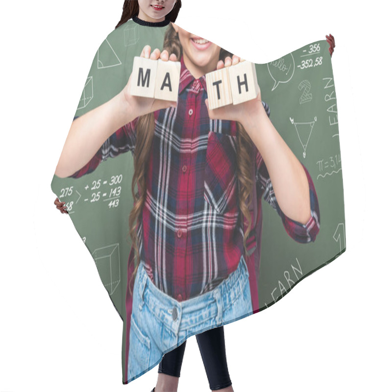 Personality  Cropped Image Of Schoolchild Holding Wooden Cubes With Word Math Near Blackboard With Mathematics Symbols Hair Cutting Cape