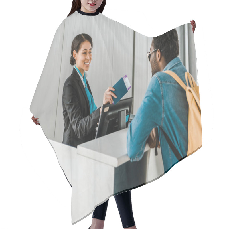 Personality  Smiling African American Airport Worker Giving Passport And Air Ticket To Tourist With Backpack Hair Cutting Cape