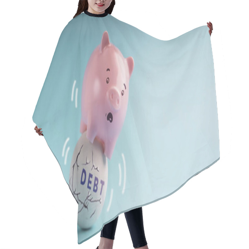 Personality  Debt Concepts. Economic Crisis. A Pink Piggy Bank In Shocked Face Trying To Balancing Body On The Shaking Unstable Debt Ball Hair Cutting Cape