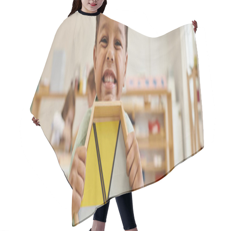 Personality  Happy African American Boy Holding Wooden Game In Blurred Montessori School, Banner Hair Cutting Cape