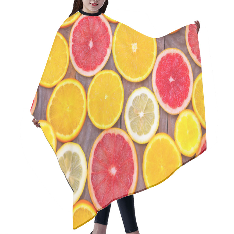 Personality  Sliced Citrus On Wooden Board Close Up. Hair Cutting Cape