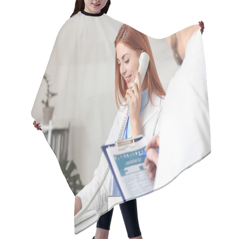 Personality  Female Medical Assistant With Doctor Working In Clinic Hair Cutting Cape