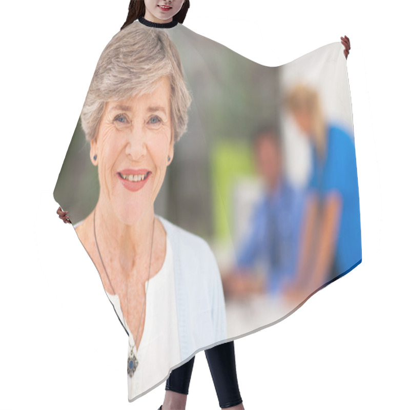 Personality  Senior Woman In Doctor's Office Hair Cutting Cape