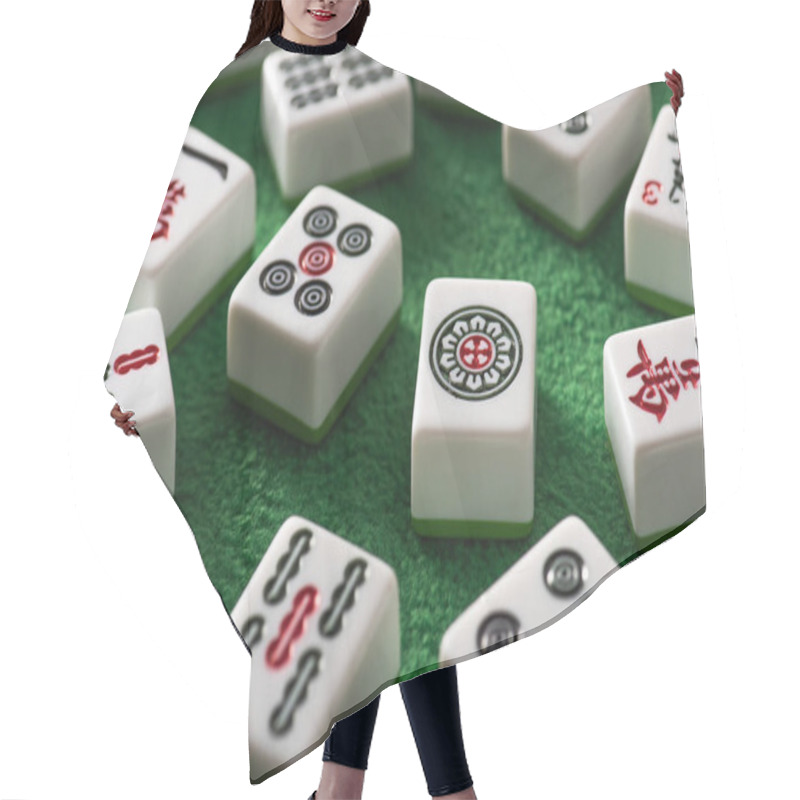 Personality  KYIV, UKRAINE - JANUARY 30, 2019: Selective Focus Of White Mahjong Game Tiles With Signs And Symbols On Green Velour Surface Hair Cutting Cape