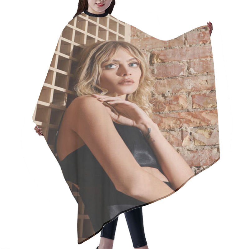 Personality  A Woman Leaning Against A Brick Wall In An Urban Setting. Hair Cutting Cape