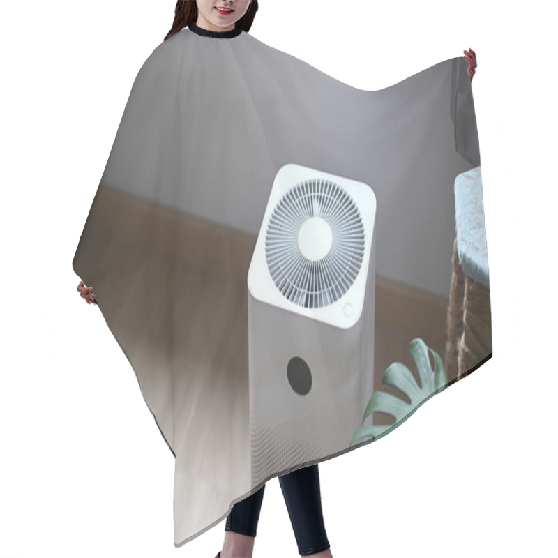 Personality  Air Purifier In Comfortable Living Room With House Plant On The Wooden Floor. Hair Cutting Cape