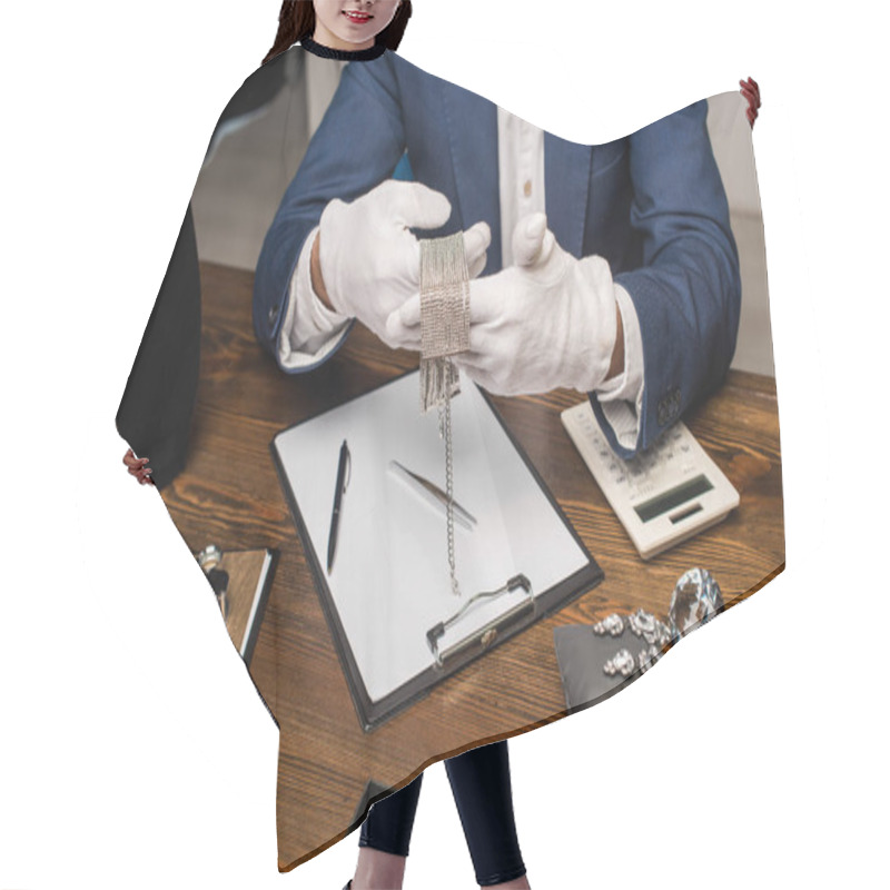 Personality  Cropped View Of Jewelry Appraiser Holding Necklace Near Calculator, Clipboard And Jewelry On Table Hair Cutting Cape