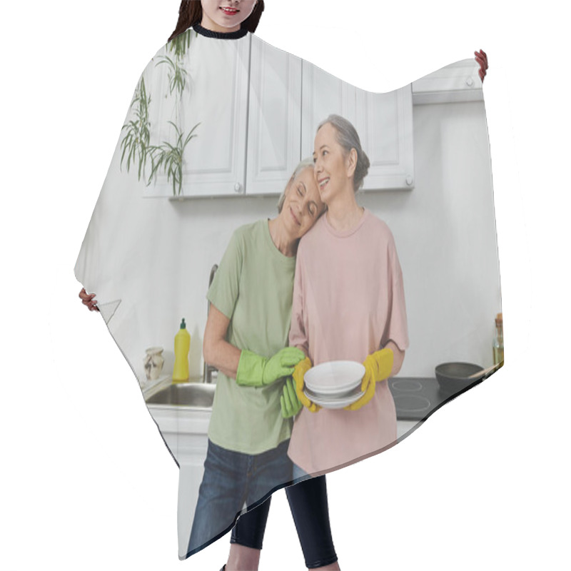 Personality  Two Mature Women, A Lesbian Couple, Stand In Their Modern Kitchen With A Happy Expression As They Complete Their Household Chores. Hair Cutting Cape