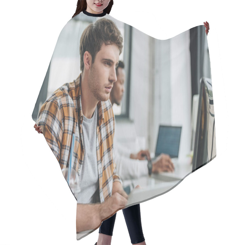 Personality  Selective Focus Of Attentive Programmer Working In Office Near African American Colleague Hair Cutting Cape