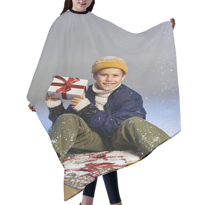 Personality  A Cheerful Boy In Winter Clothes Smiles Brightly Among Festive Gift Boxes. Hair Cutting Cape