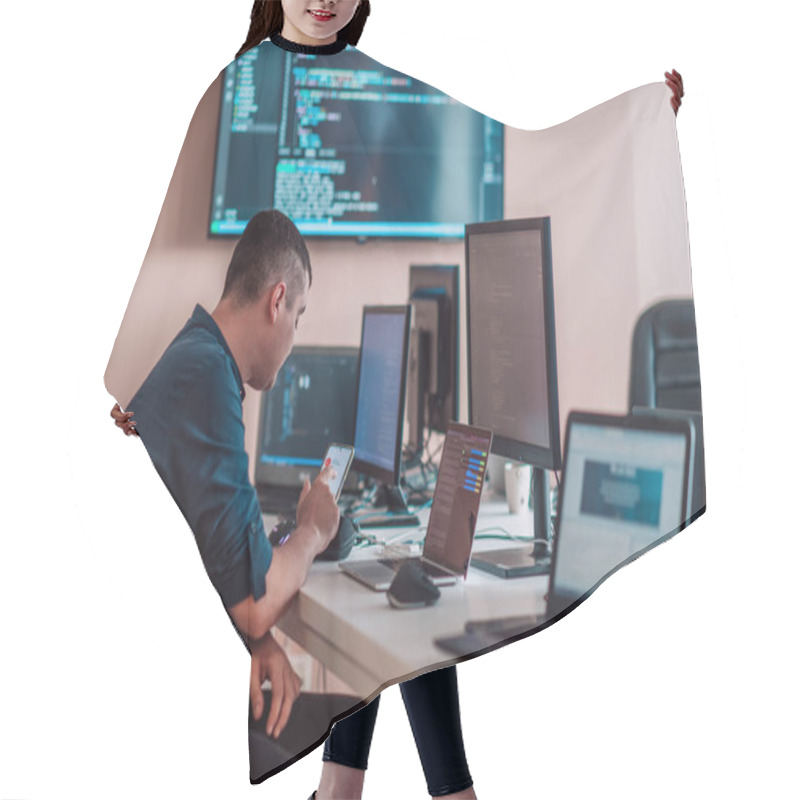 Personality  A Programmer Diligently Testing Smartphone Applications While Sitting In Their Office. High Quality Photo Hair Cutting Cape