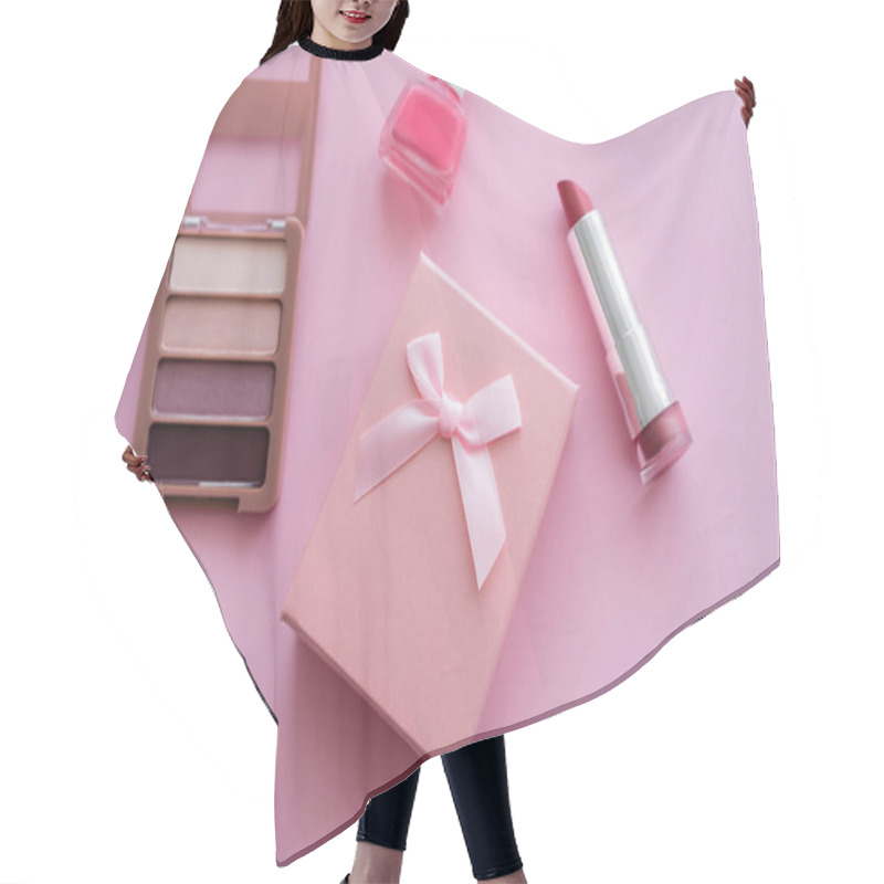 Personality  Top View Of Present With Bow Near Decorative Cosmetics On Pink Hair Cutting Cape