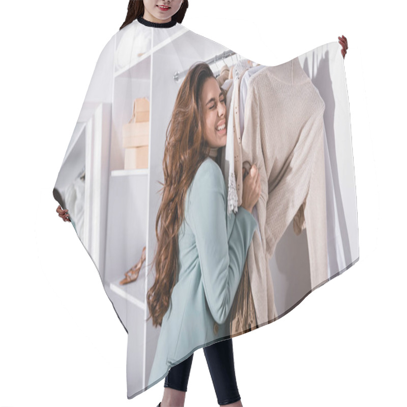 Personality  Cheerful Woman Holding Clothes On Hangers In Wardrobe  Hair Cutting Cape