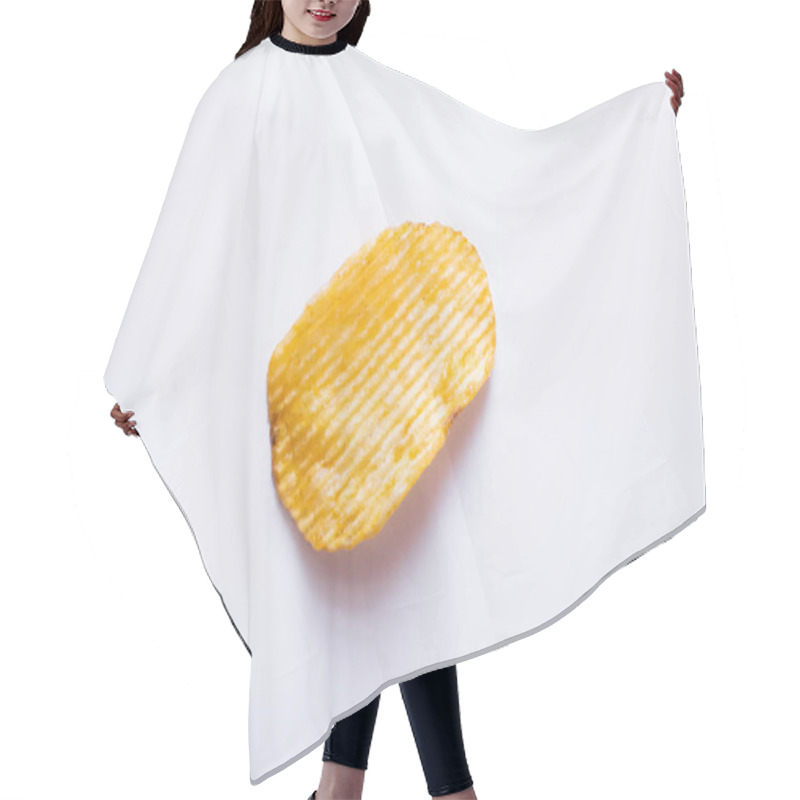 Personality  Top View Of Single Wavy And Salty Potato Chip On White Hair Cutting Cape