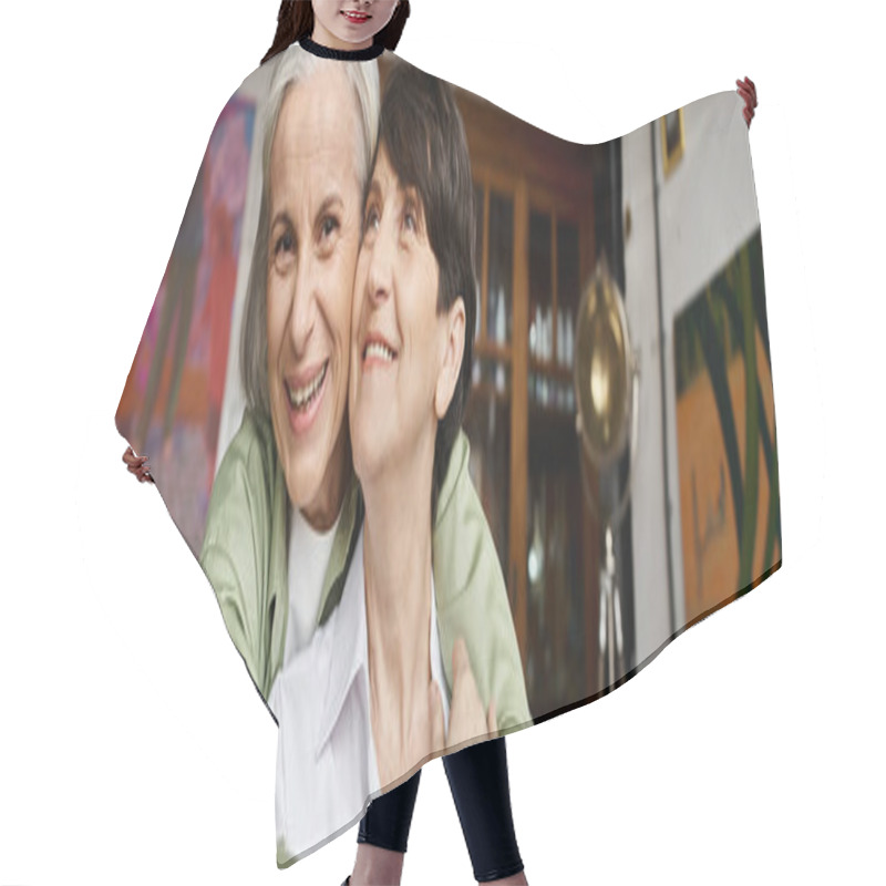 Personality  Cheerful Woman Embraces Brunette Woman In A Warm Setting. Hair Cutting Cape