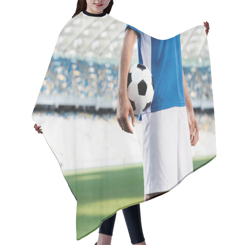 Personality  Cropped View Of Professional Soccer Player In Blue And White Uniform With Ball On Football Pitch At Stadium Hair Cutting Cape