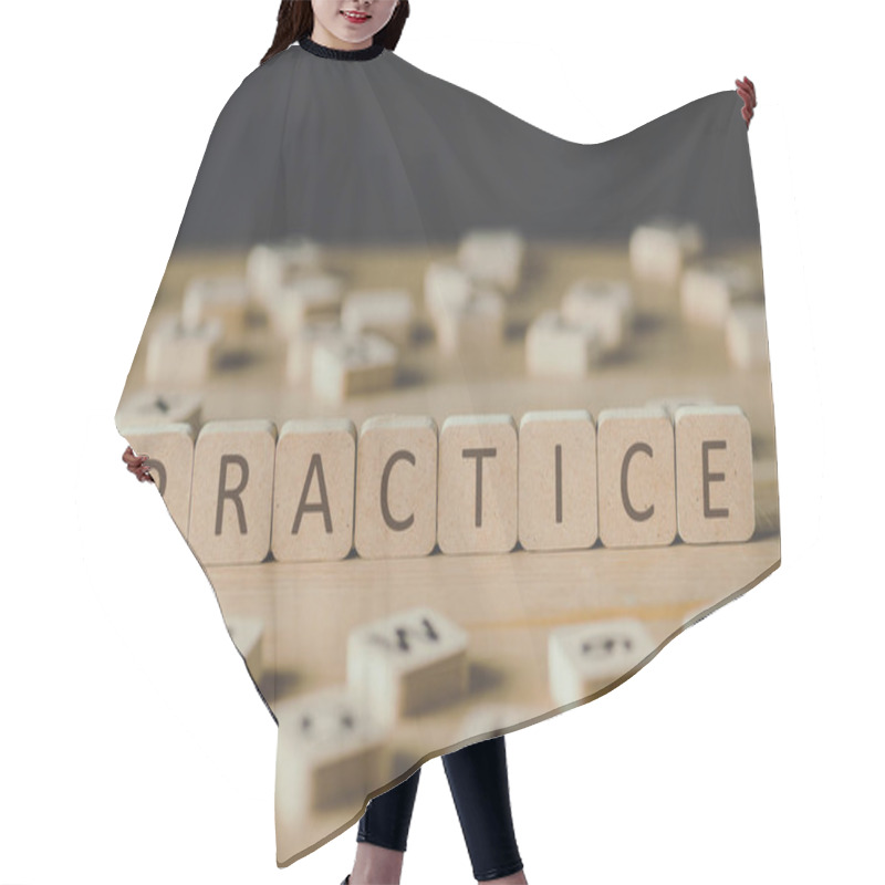 Personality  Selective Focus Of Practice Lettering On Cubes Surrounded By Blocks With Letters On Wooden Surface Isolated On Black Hair Cutting Cape