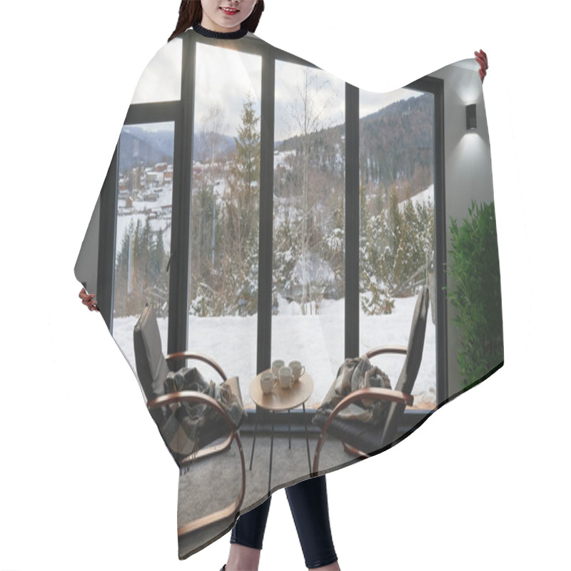 Personality  Cozy Room With Small Coffee Table And Armchairs In Front Of Large Panoramic Window. Front View Of Two Wooden Chairs And Table Against Wide Window With Snowy Mountain Landscape. Concept Of Holidays. Hair Cutting Cape