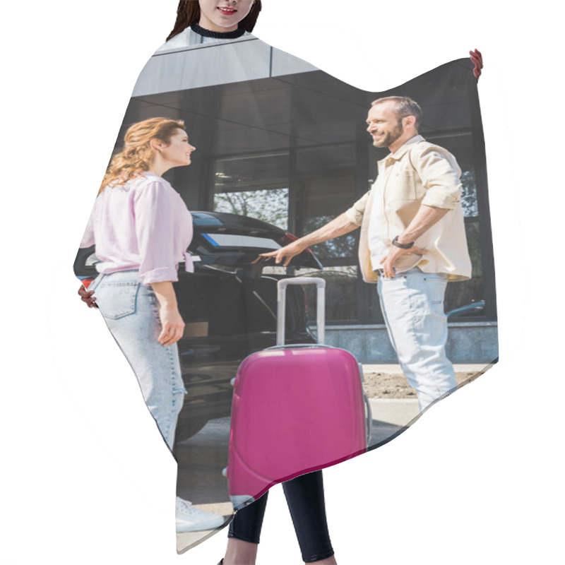 Personality  Handsome And Cheerful Man Looking At Happy Woman While Standing Near Car And Pink Luggage  Hair Cutting Cape