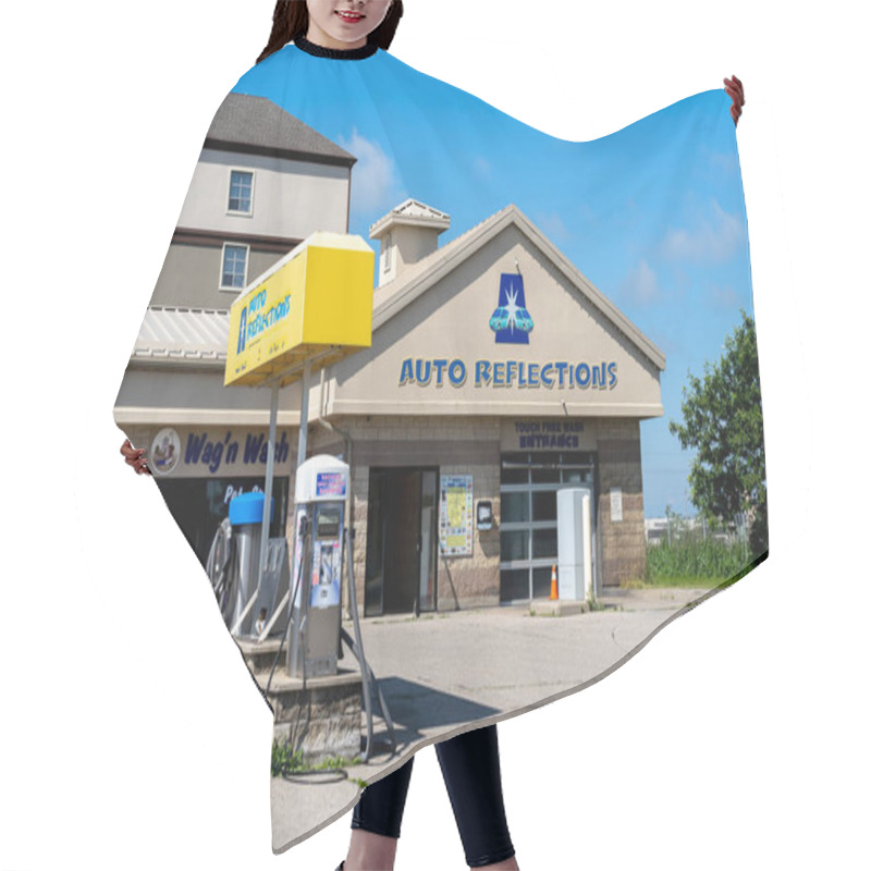 Personality  Guelph, Ontario, Canada - June 28, 2020: An Auto Reflections Car Care Shop In Guelph, Ontario, Canada.  Hair Cutting Cape