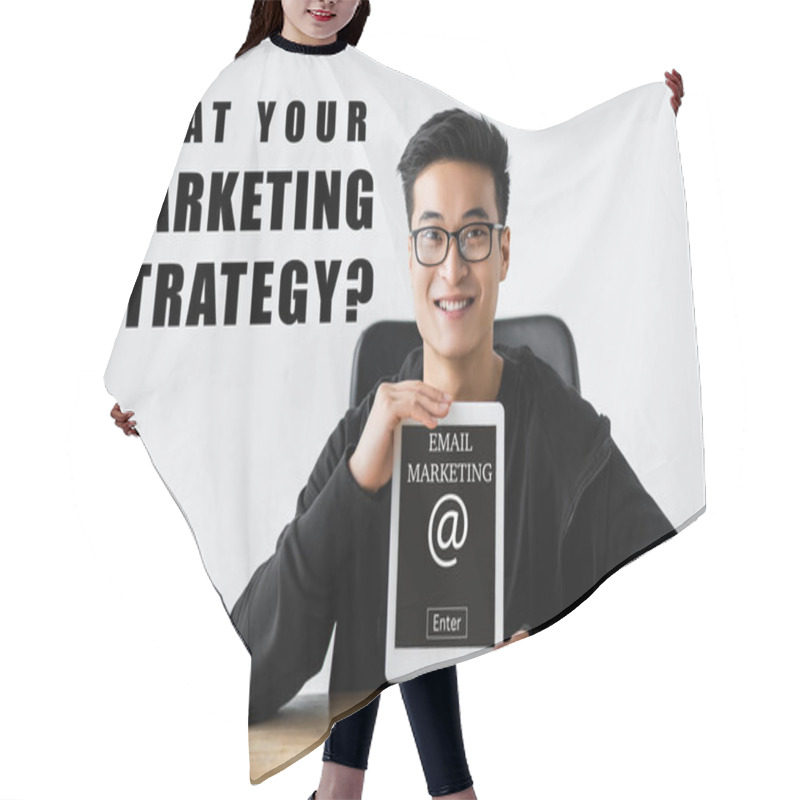 Personality  Smiling Asian Seo Manager Holding Digital Tablet With E-mail Marketing Lettering And Sitting Near What Your Marketing Strategy Illustration Hair Cutting Cape