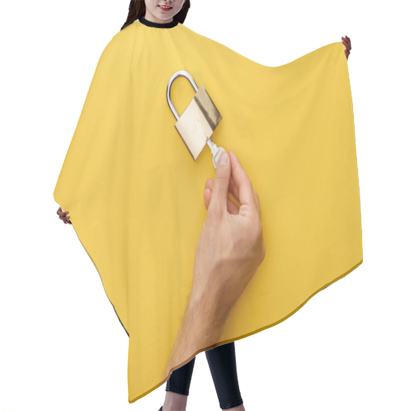 Personality  Cropped View Of Man Holding Key In Padlock On Yellow Background Hair Cutting Cape