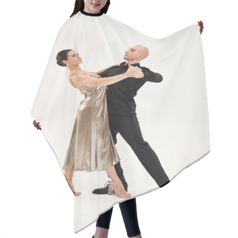 Personality  A Young Man In Black And A Young Woman In A Dress Perform Acrobatic Dance Moves Together In A Studio Setting. Hair Cutting Cape