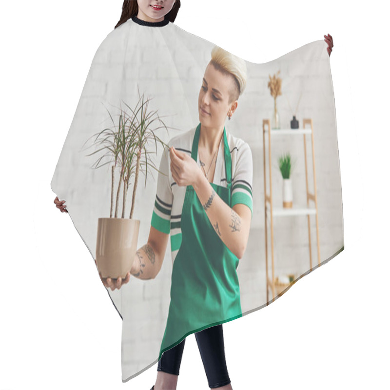 Personality  Indoor Gardening, Young And Positive Tattooed Woman In Green Apron Touching Leaves Of Tropical Plant In Modern Apartment, Plant Care, Sustainable Home Decor And Green Living Concept Hair Cutting Cape