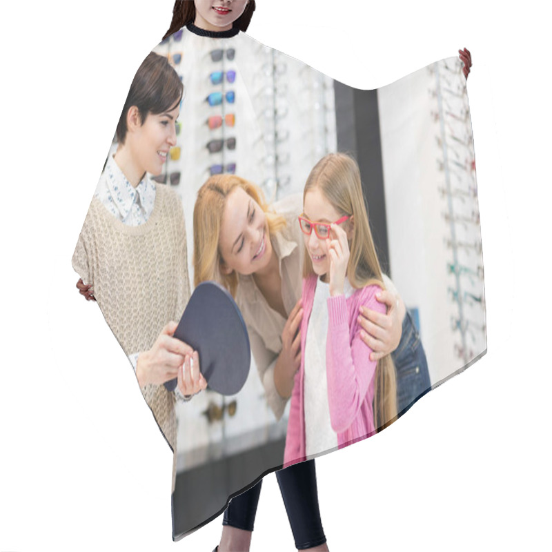 Personality  Saleswoman Hold Mirror While Child Try Frames For Eyeglasses Hair Cutting Cape