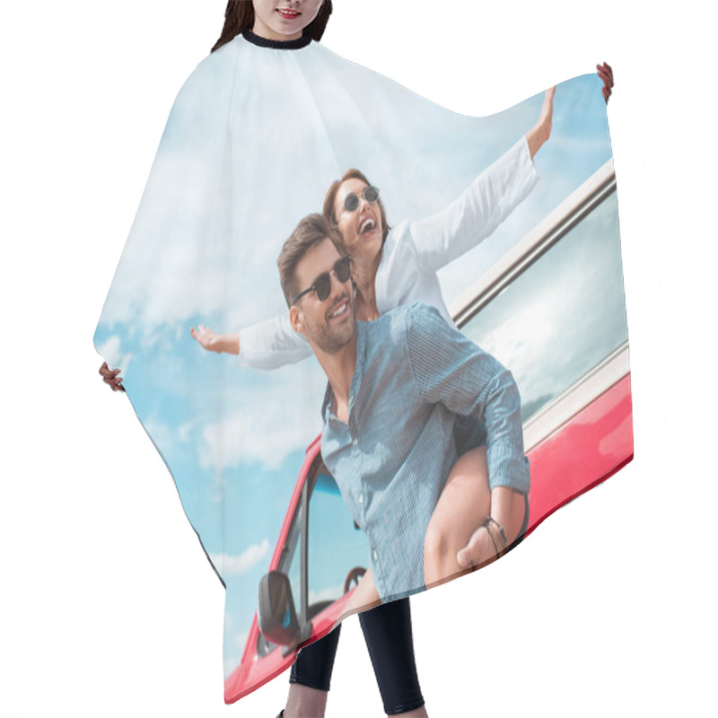 Personality  Excited Young Couple Of Travelers Piggybacking At Car Hair Cutting Cape