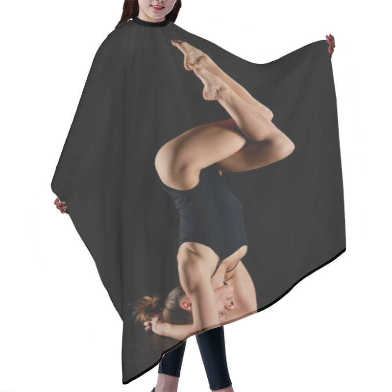 Personality  Woman With Barefoot Doing Eagle Legs Handstand Exercise Isolated On Black  Hair Cutting Cape