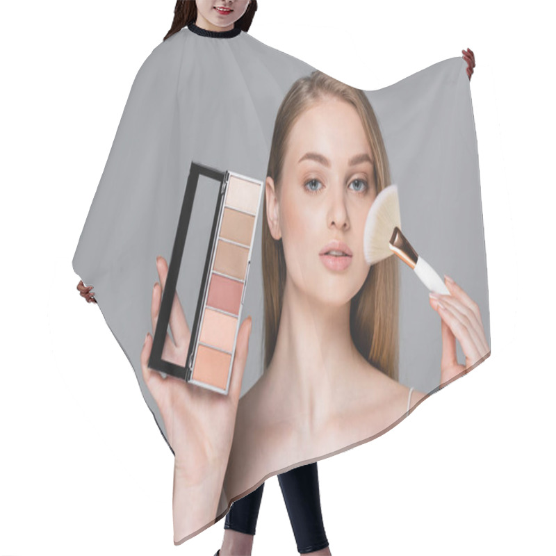 Personality  Young Woman Holding Cosmetic Brush And Eye Shadow And Blush Palette Isolated On Grey Hair Cutting Cape