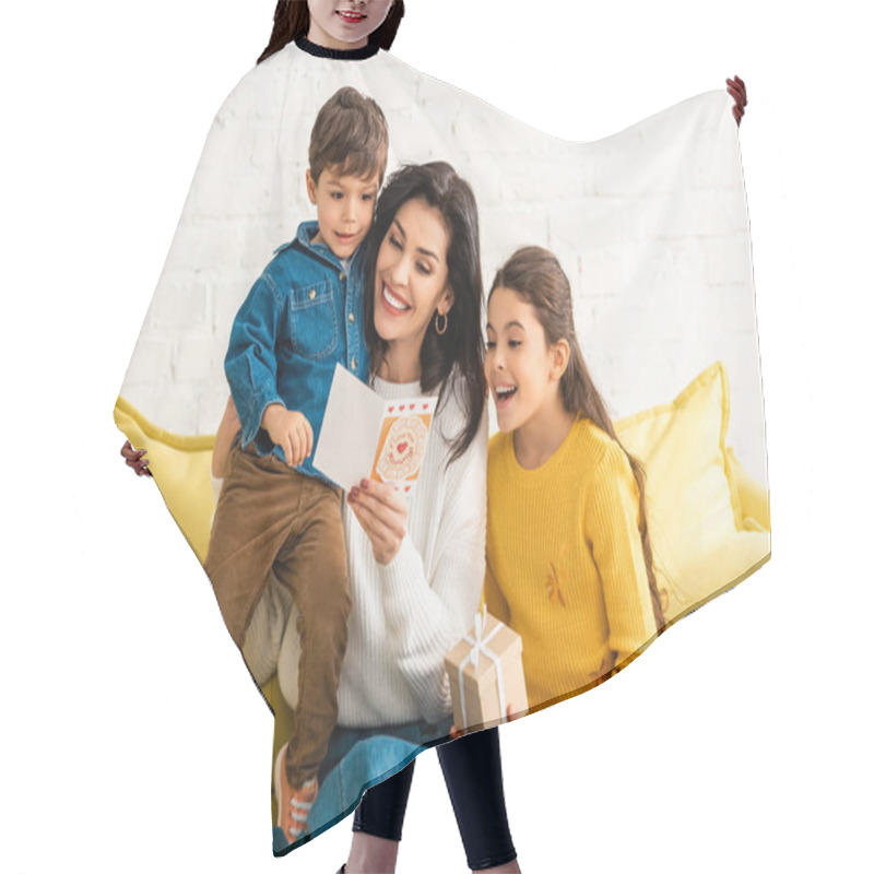 Personality  Happy Woman Holding Mothers Day Card And Embracing Son, While Daughter Holding Gift Box Hair Cutting Cape