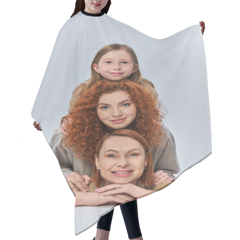 Personality  Three Generations, Happy Redhead Family In Beige Coats Smiling On Grey Backdrop, Female Bond Hair Cutting Cape