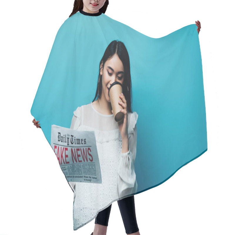 Personality  Asian Woman In White Blouse Holding Newspaper With Fake News And Drinking Coffee On Blue Background Hair Cutting Cape