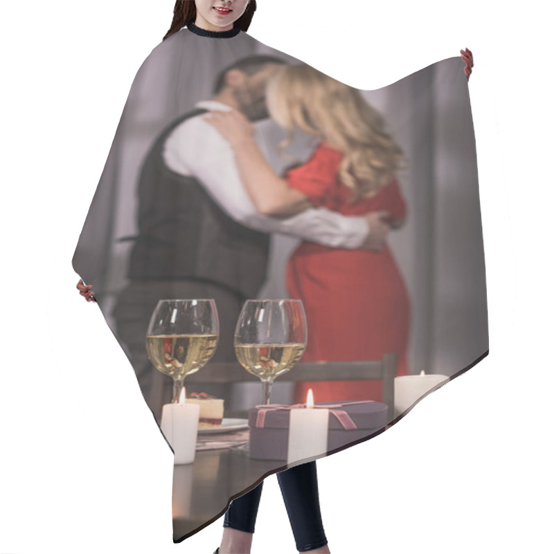 Personality  Heterosexual Couple Standing And Kissing At Home With Wineglasses On Foreground Hair Cutting Cape