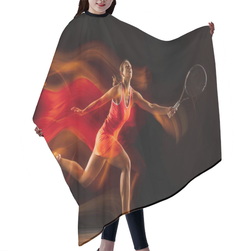 Personality  Professional female tennis player isolated on black studio background in mixed light hair cutting cape