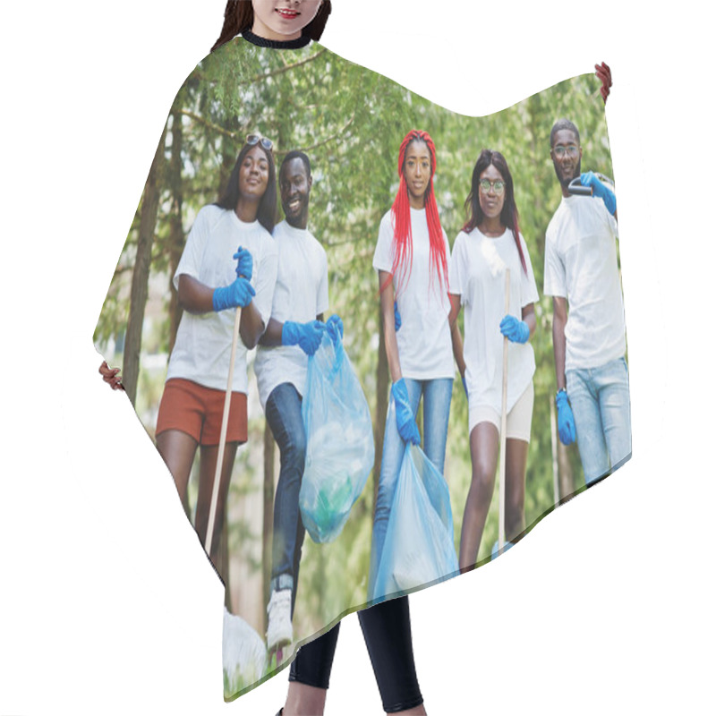 Personality  Group of happy african volunteers with garbage bags cleaning are hair cutting cape