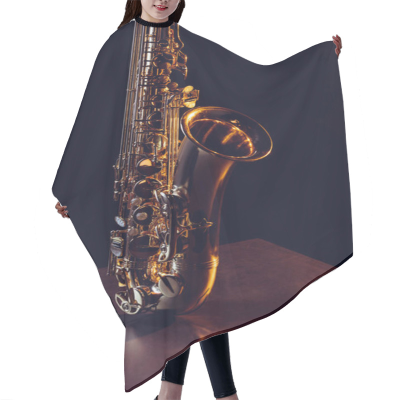 Personality  Close-up View Of Shiny Professional Saxophone On Black  Hair Cutting Cape