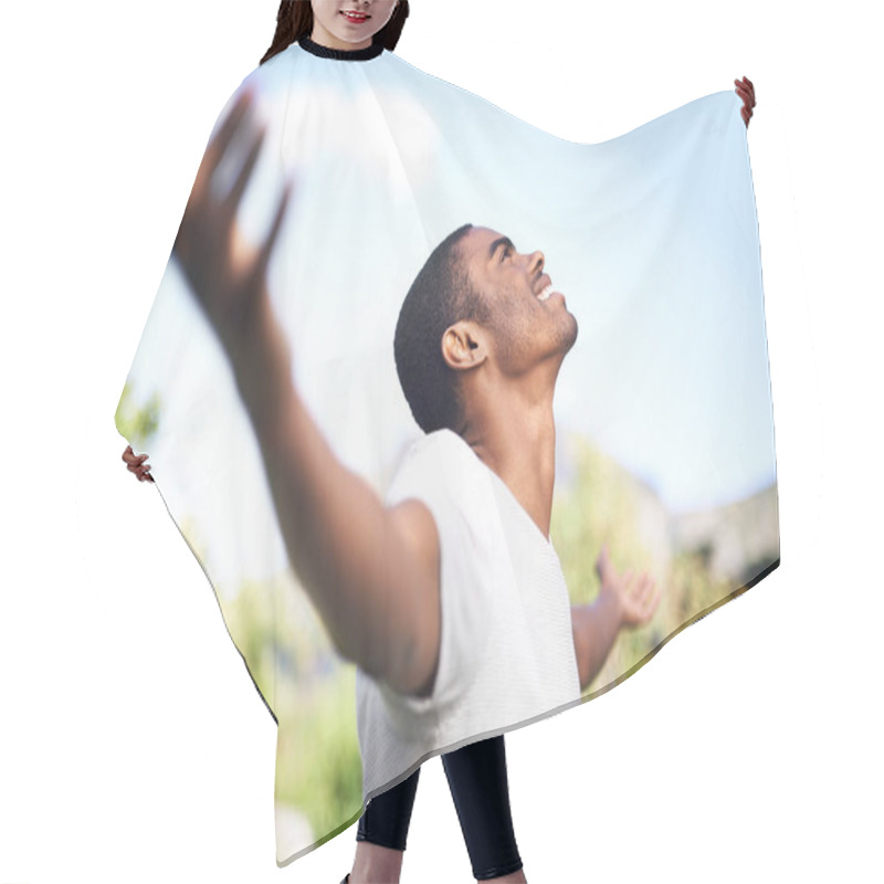 Personality  Under The Wide Blue Sky. A Young Man With Arms Outstretched Outdoors Hair Cutting Cape