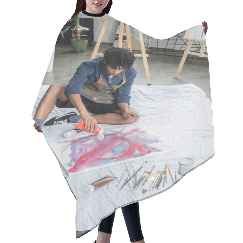 Personality  African American Artist Pouring Paint On Canvas On Cloth In Studio  Hair Cutting Cape