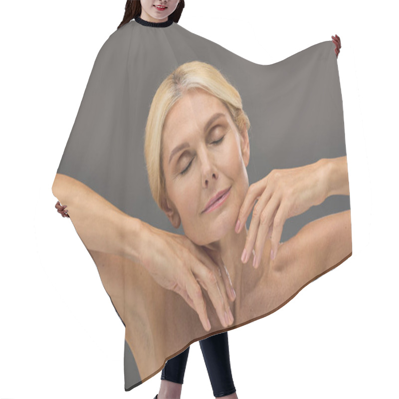 Personality  Appealing Mature Woman With Blonde Hair Posing On Gray Backdrop. Hair Cutting Cape