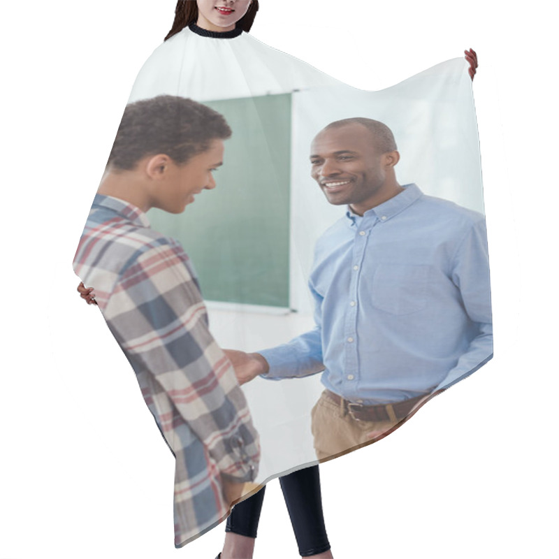 Personality  African American Teacher Talking To High School Student In Classroom  Hair Cutting Cape