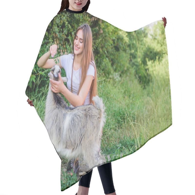 Personality  Girl Play Cute Goat. Farm And Farming Concept. Village Animals. Protect Animals. Veterinarian Occupation. Eco Farm. Love And Care. Feeding Animal. Animals Law. Woman And Small Goat Green Grass Hair Cutting Cape